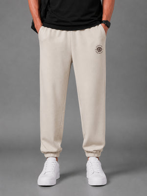 Beige Solid Relaxed Fit Elastic Cotton Jogger